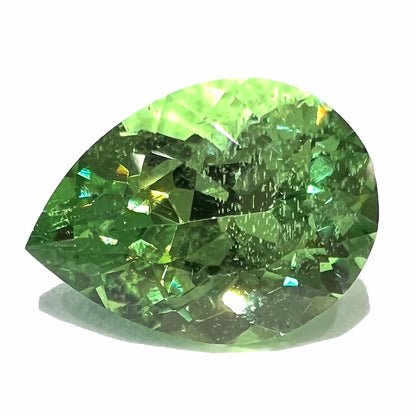 A loose, pear shaped tsavorite garnet gemstone.  The stone is yellowish green and weighs 2.97 carats.