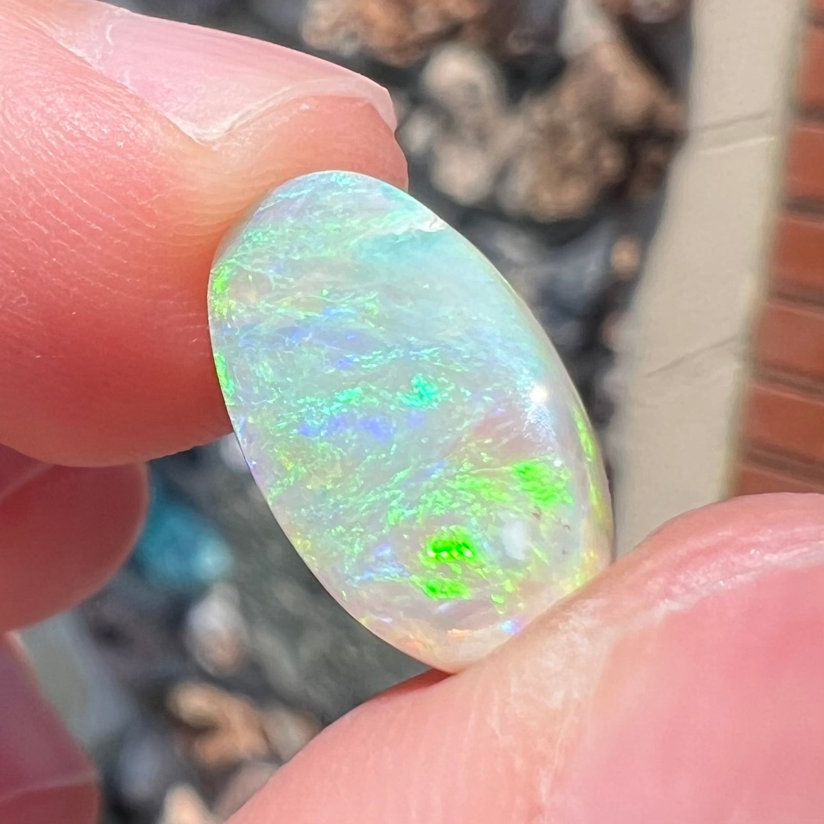 A loose, Lightning Ridge light crystal opal.  The opal is predominantly green.