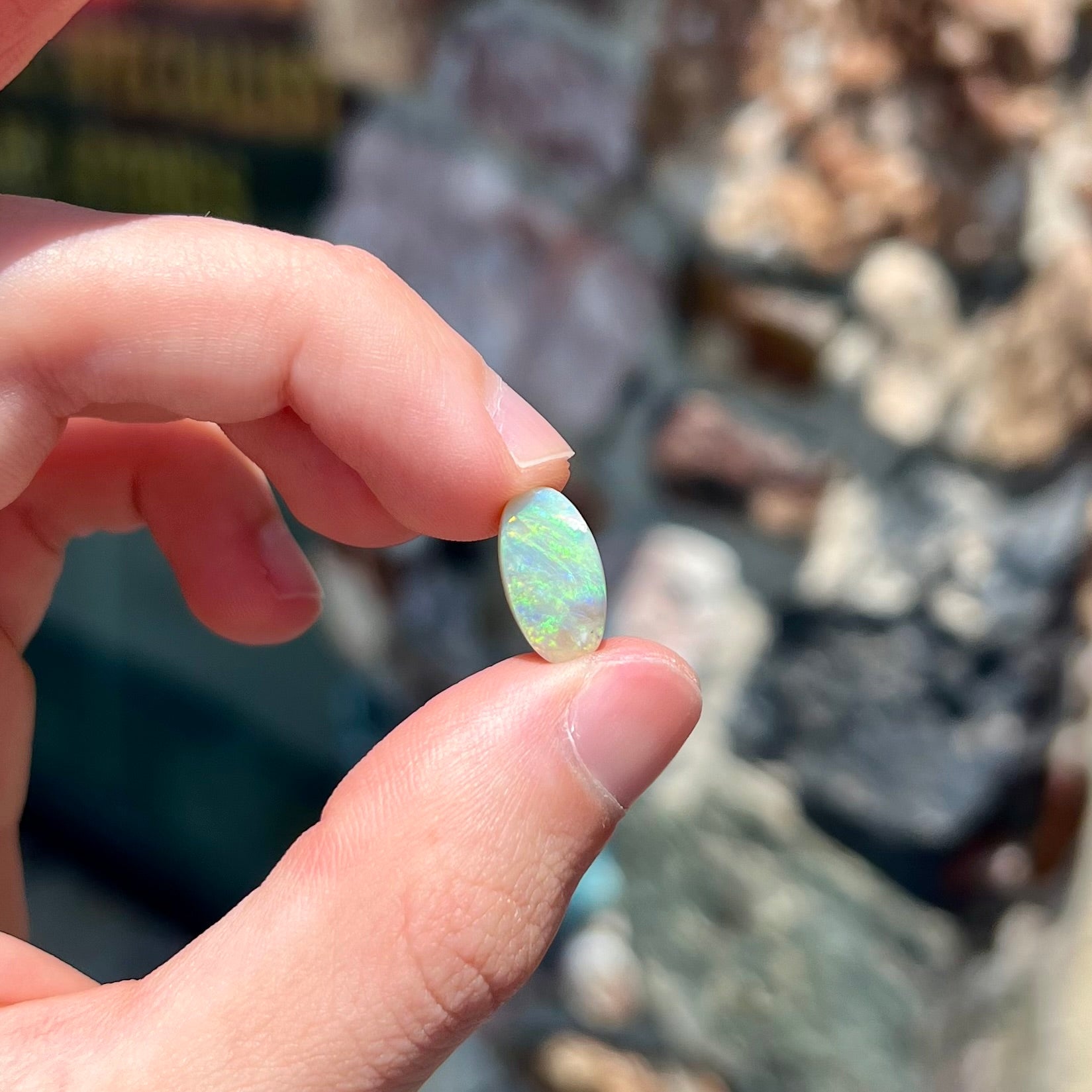 A loose, Lightning Ridge light crystal opal.  The opal is predominantly green.