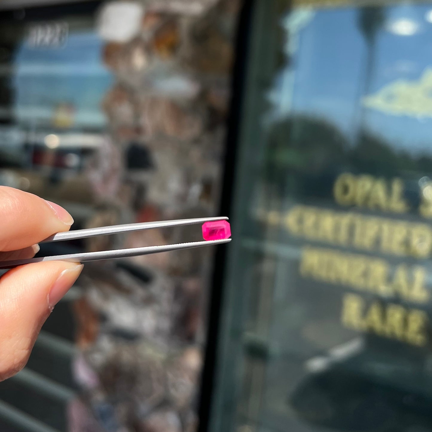A natural, emerald cut Burma ruby gemstone.  The stone is pinkish red color.