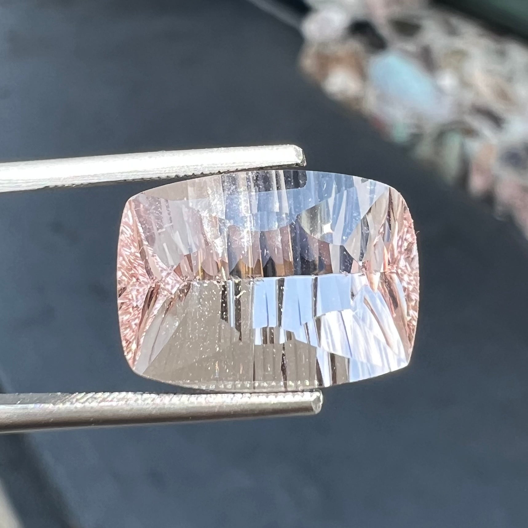 A loose, modified cushion cut pink morganite stone.