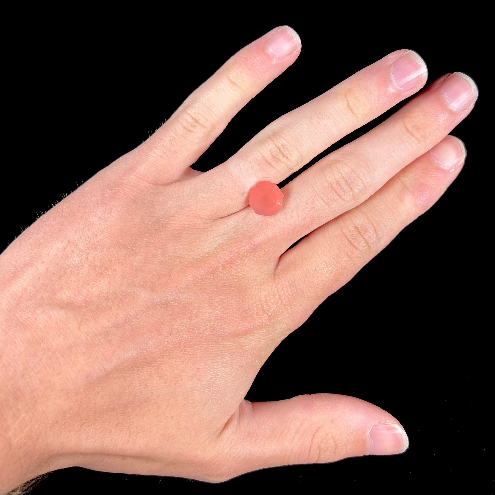 A faceted, octagon cut pink fire opal from Mexico.