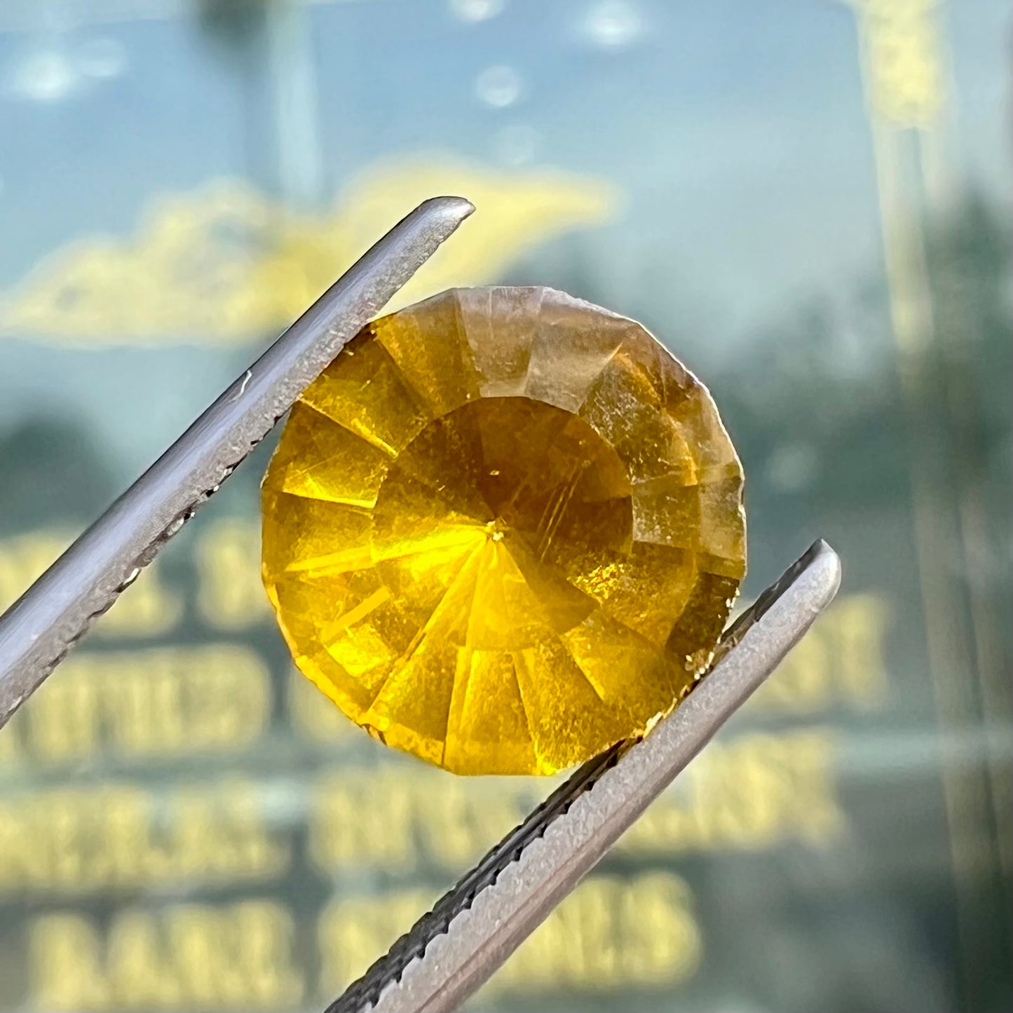 A loose, modified round brilliant cut sphalerite gemstone.