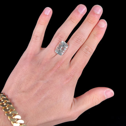 A loose, cushion laser cut white topaz stone.