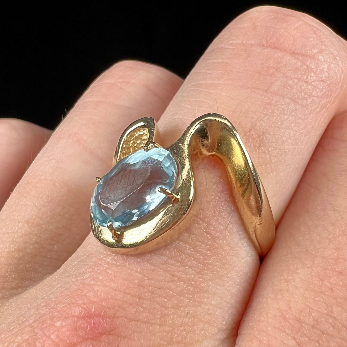 A ladies' estate yellow gold aquamarine solitaire ring.  The aquamarine is oval cut.