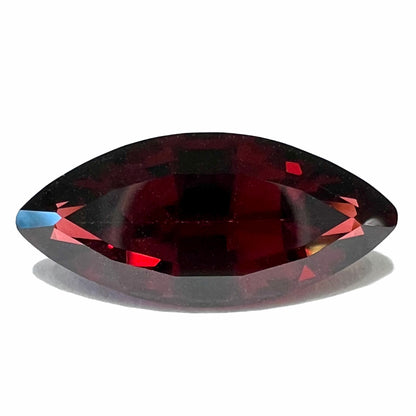 A faceted marquise cut red pyrope garnet stone.  The gem weighs 4.17 carats.