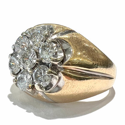 A men's textured yellow gold ring set with a cluster of seven round brilliant cut natural diamonds.