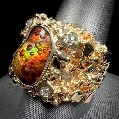 A men's heavy, yellow gold, nugget-style ring bezel set with a Mexican fire agate stone and diamonds.