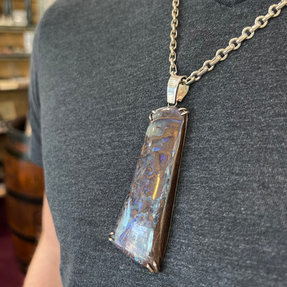 A men's sterling silver pendant set with a natural boulder opal from Quilpie, Australia.