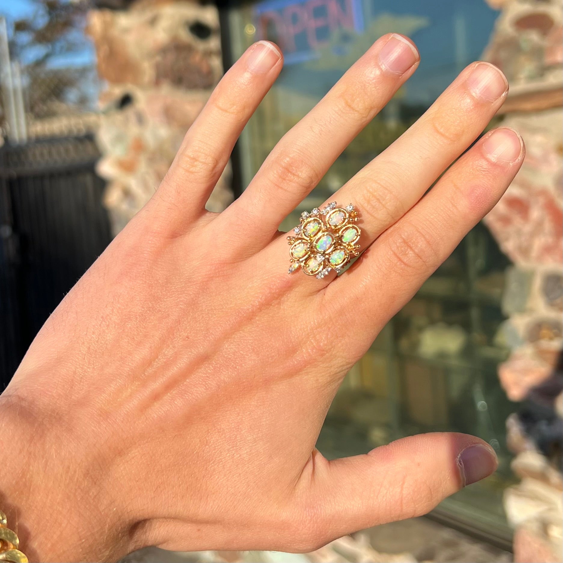 A ladies' vintage mid-century modern style opal and diamond cluster ring in yellow gold.