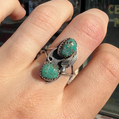A ladies' sterling silver and green Morenci turquoise ring.  The ring is handmade in the Navajo style.