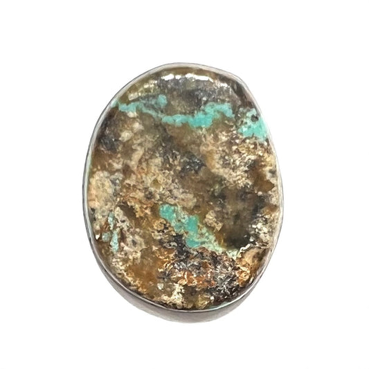 A loose, oval cabochon cut Morenci turquoise stone.