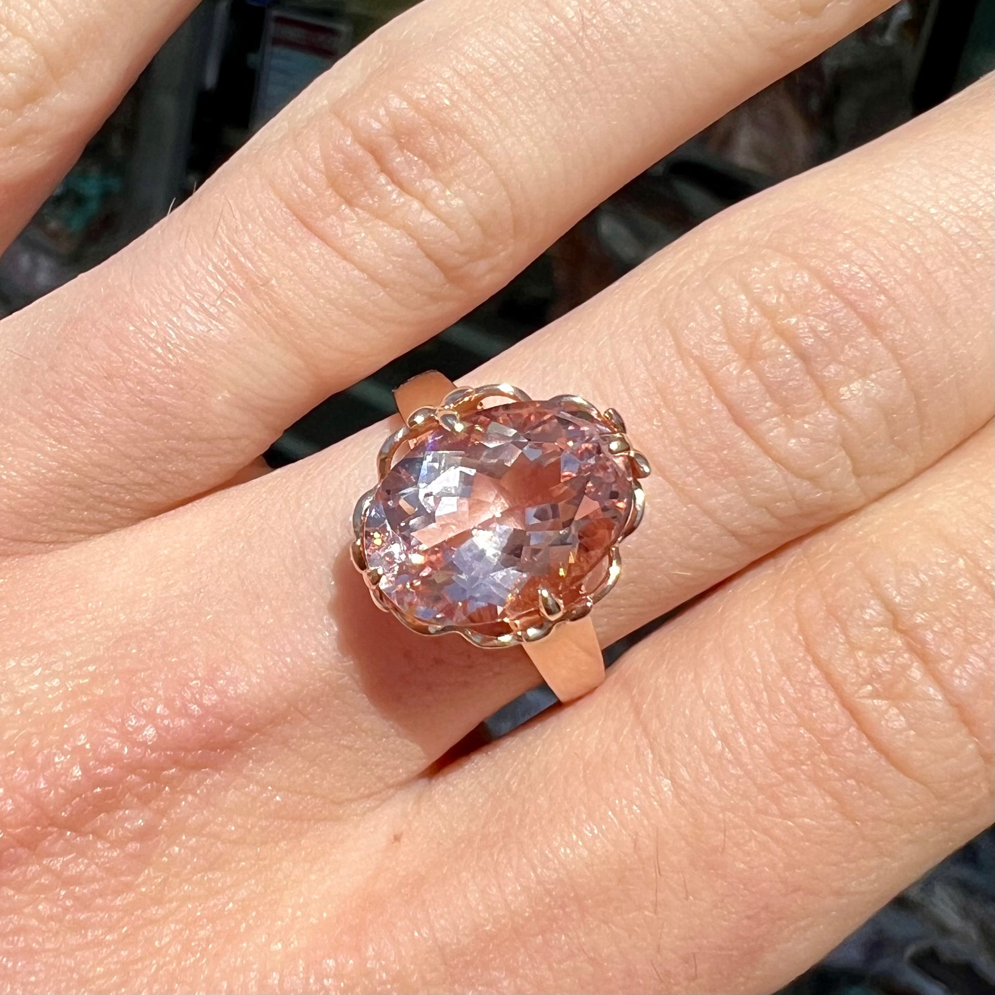 A ladies' rose gold solitaire ring set with an oval cut pink morganite gemstone.