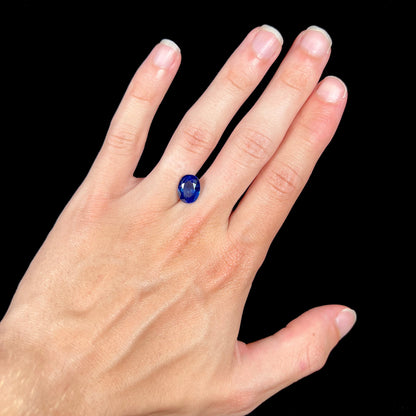A natural, faceted oval cut blue sapphire stone that weighs 4.80 carats.