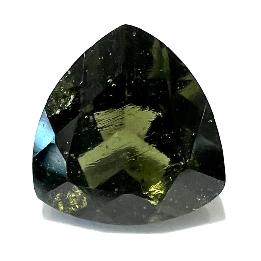 A faceted trillion cut natural moldavite gemstone that weighs 2.92 carats.  The stone is dark green color.