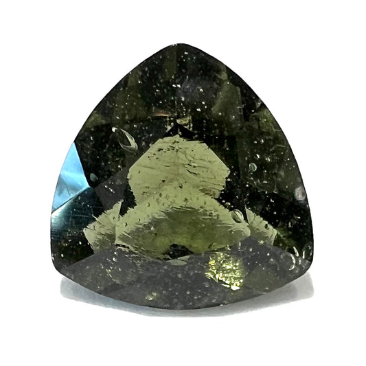 A trillion cut natural moldavite gemstone.  The stone shows elongated bubble inclusions.