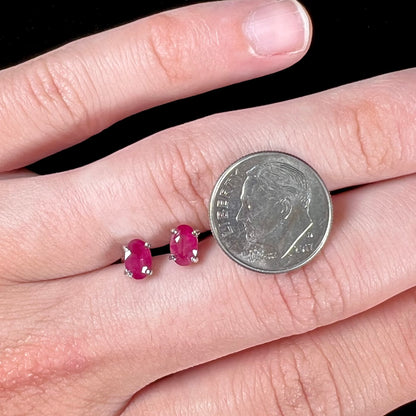 A pair of natural Burma ruby stud earrings set in white gold.  The rubies are a purplish red color.