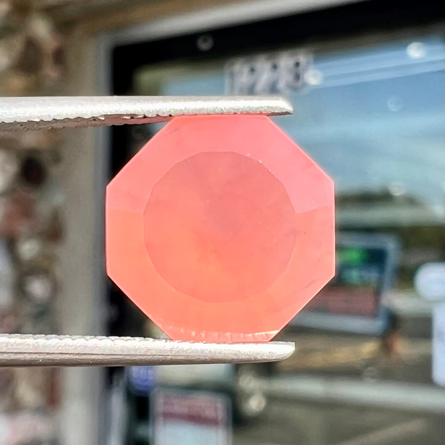 A faceted, octagon cut pink fire opal from Mexico.