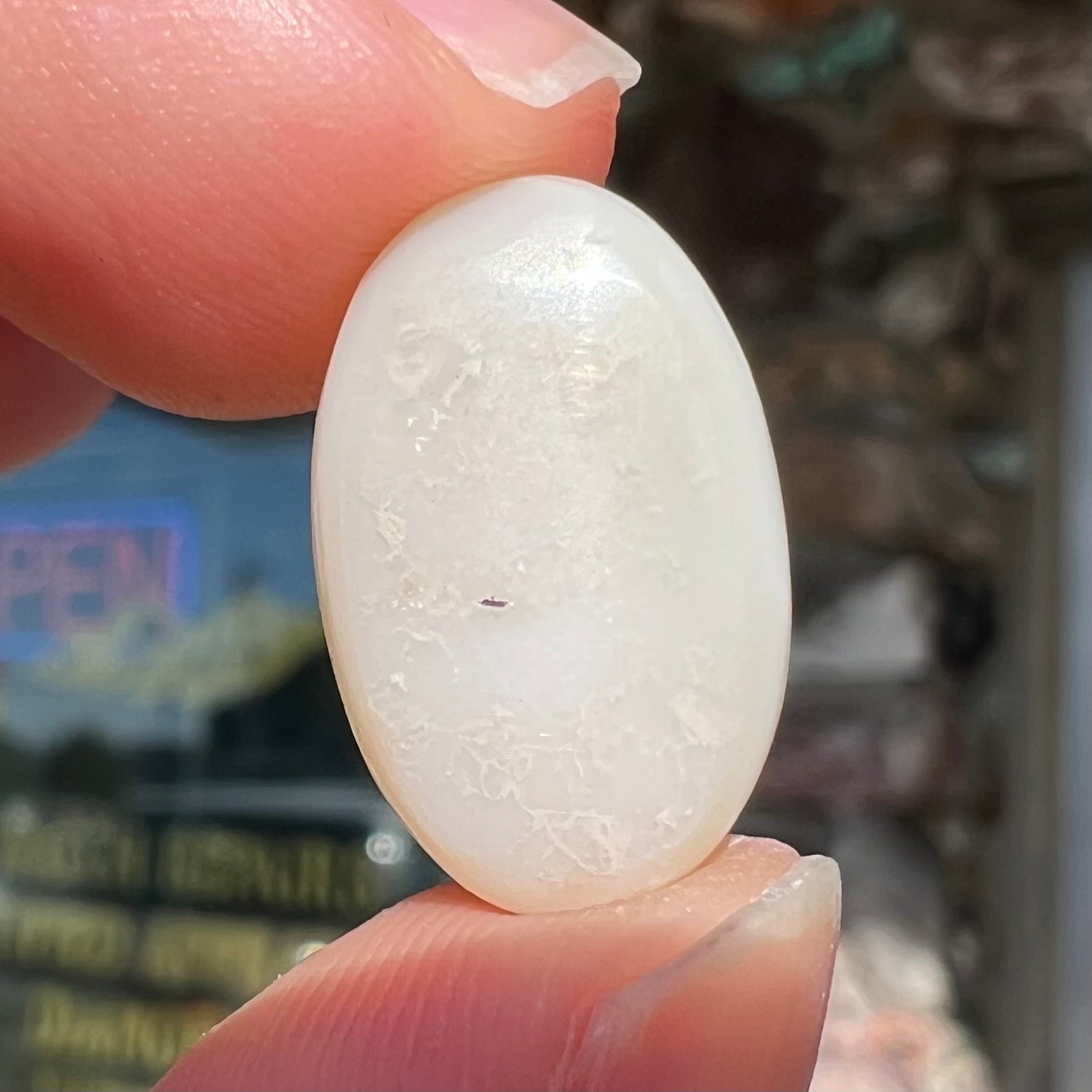 The back of a white opal stone.
