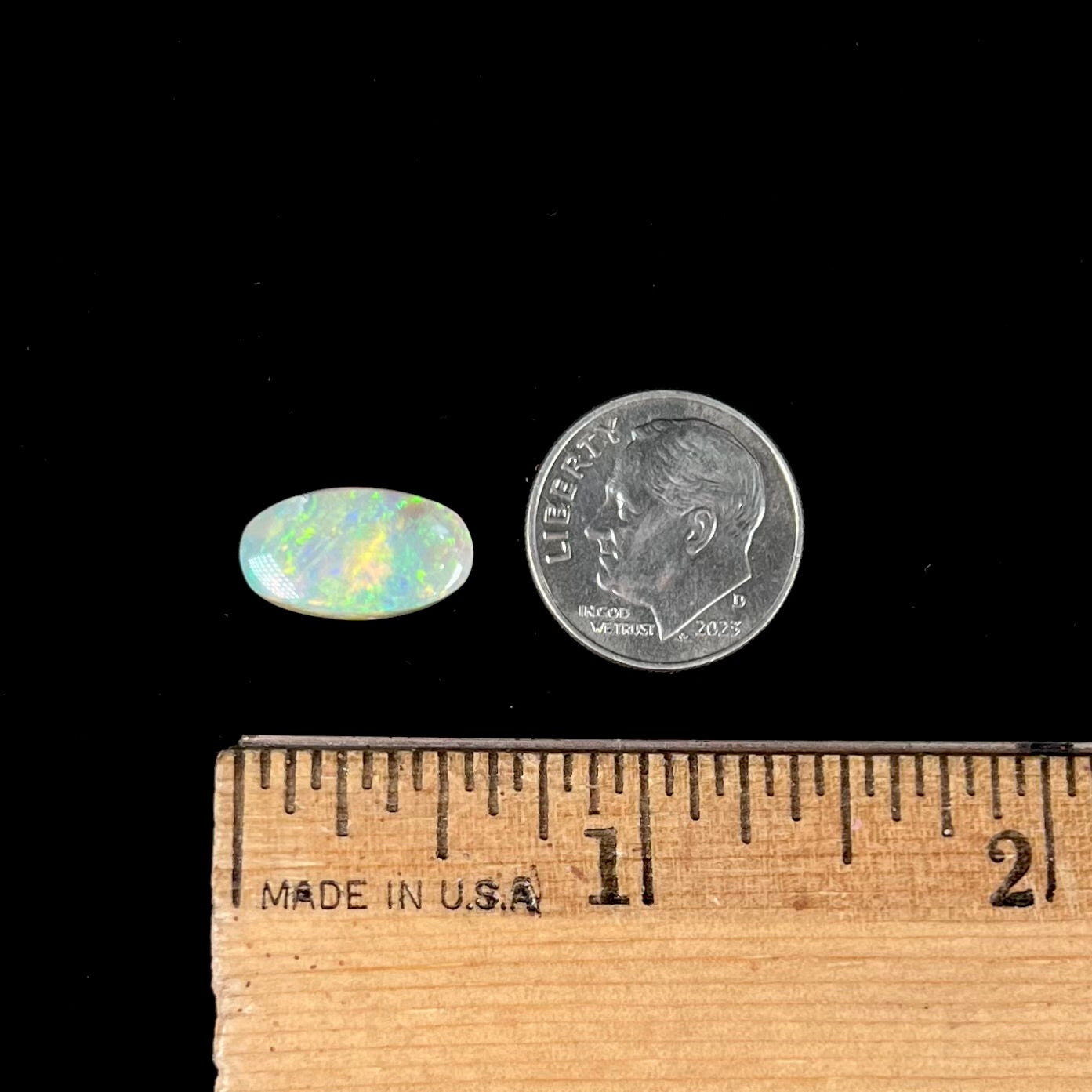 A loose, Lightning Ridge light crystal opal.  The opal is predominantly green.