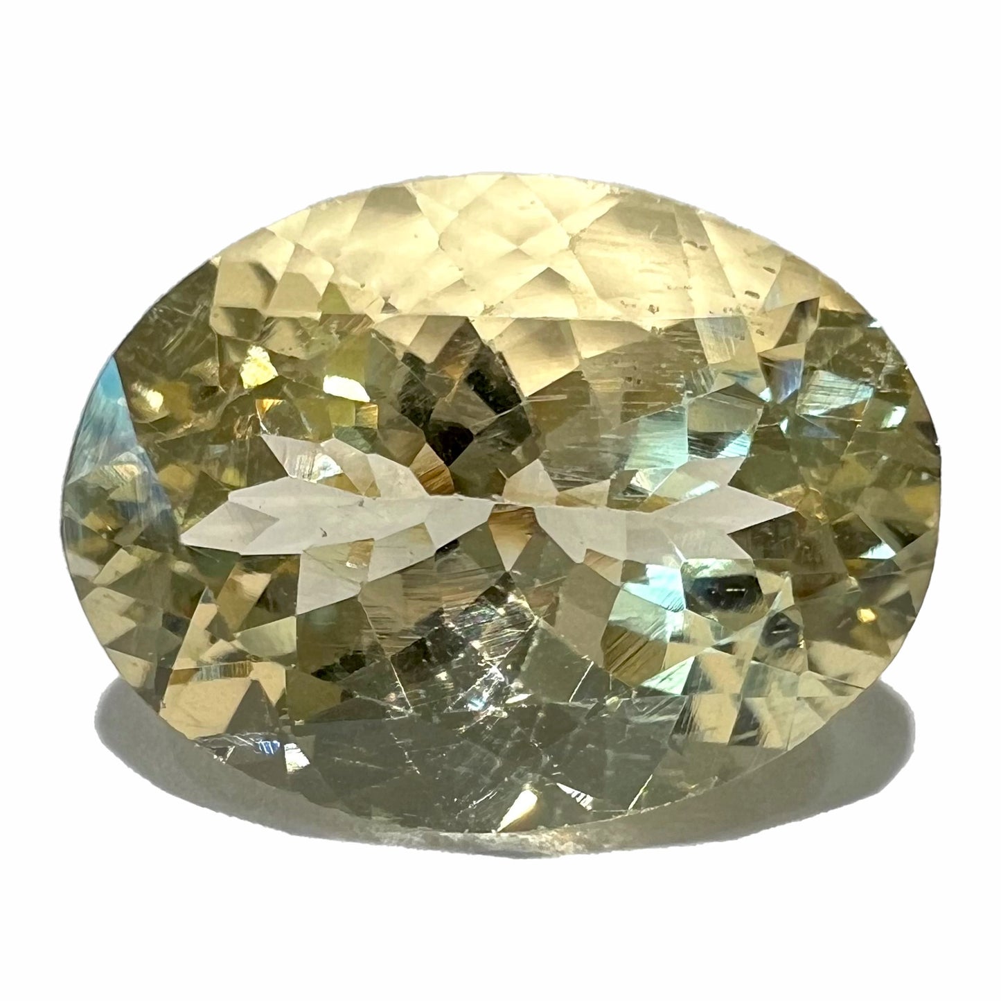 A loose, faceted oval cut citrine stone.  The stone is light yellow in color and weighs 8.35 carats.