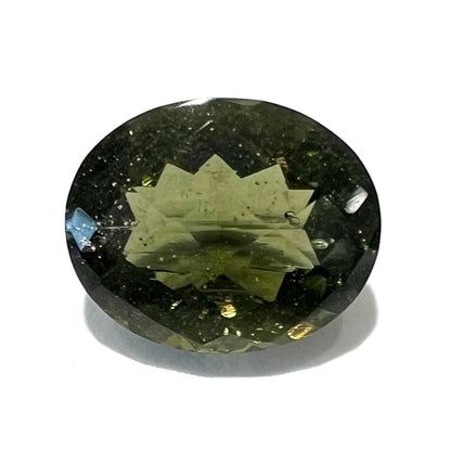 A loose, faceted oval checkerboard moldavite gemstone from the Czech Republic.  The stone weighs 2.31 carats.