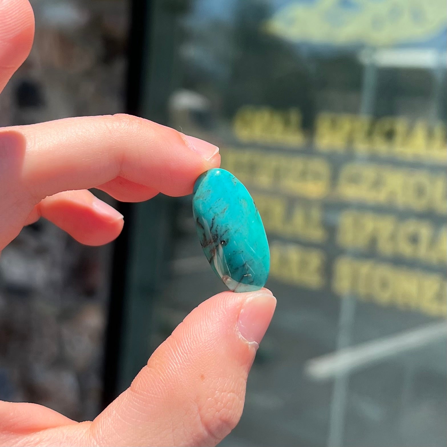 A loose, oval cabochon cut turquoise stone from Royston District, Nevada.