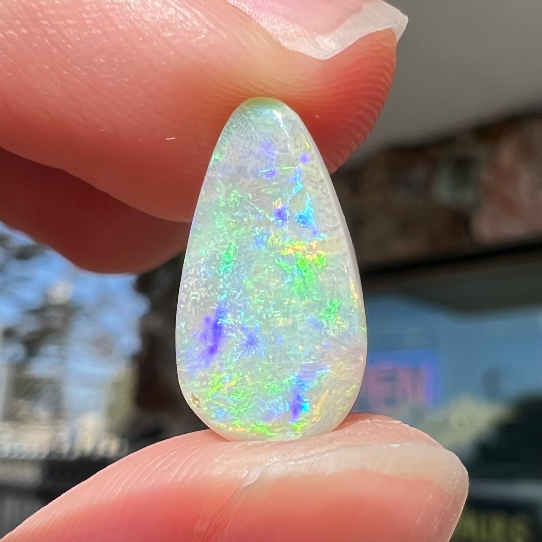 A pear shaped light opal stone from Lightning Ridge, Australia.