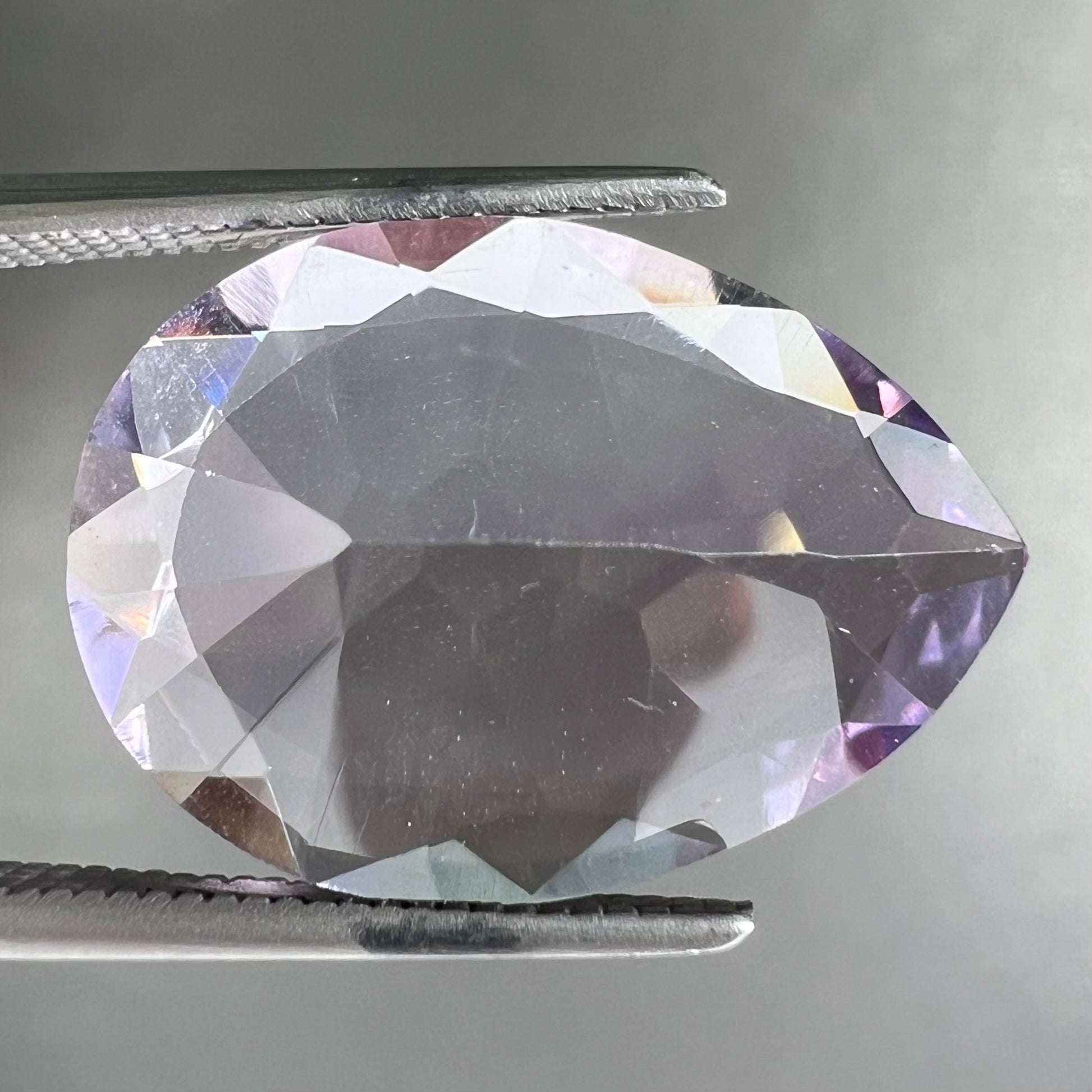 A faceted pear shaped rose de France colored amethyst gemstone.