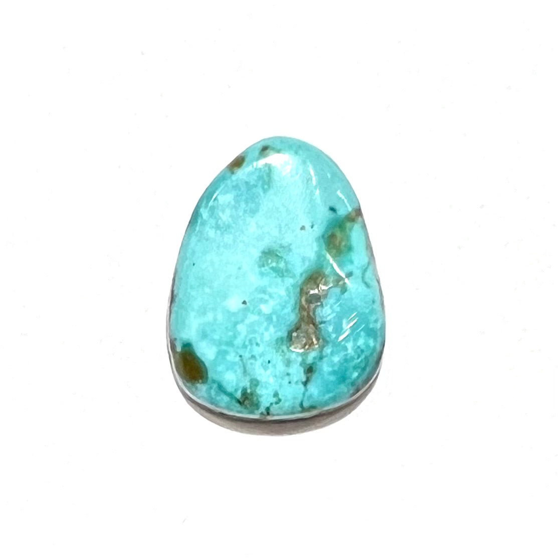A loose, freeform pear shaped turquoise cabochon.  The stone is from the Pilot Mountain Mine in Nevada.