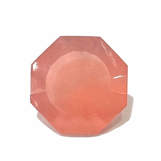 A faceted, octagon cut pink fire opal from Mexico.