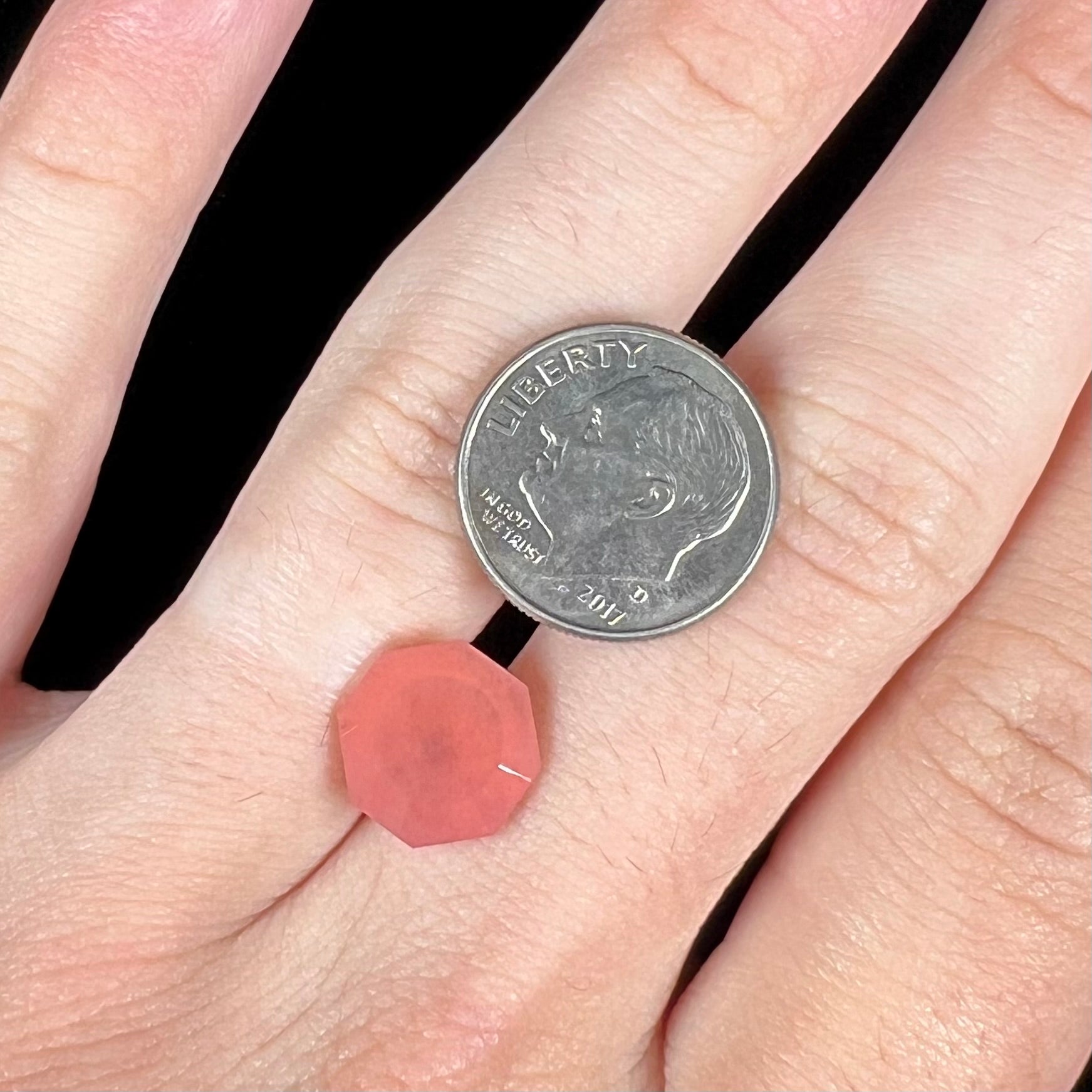 A faceted, octagon cut pink fire opal from Mexico.