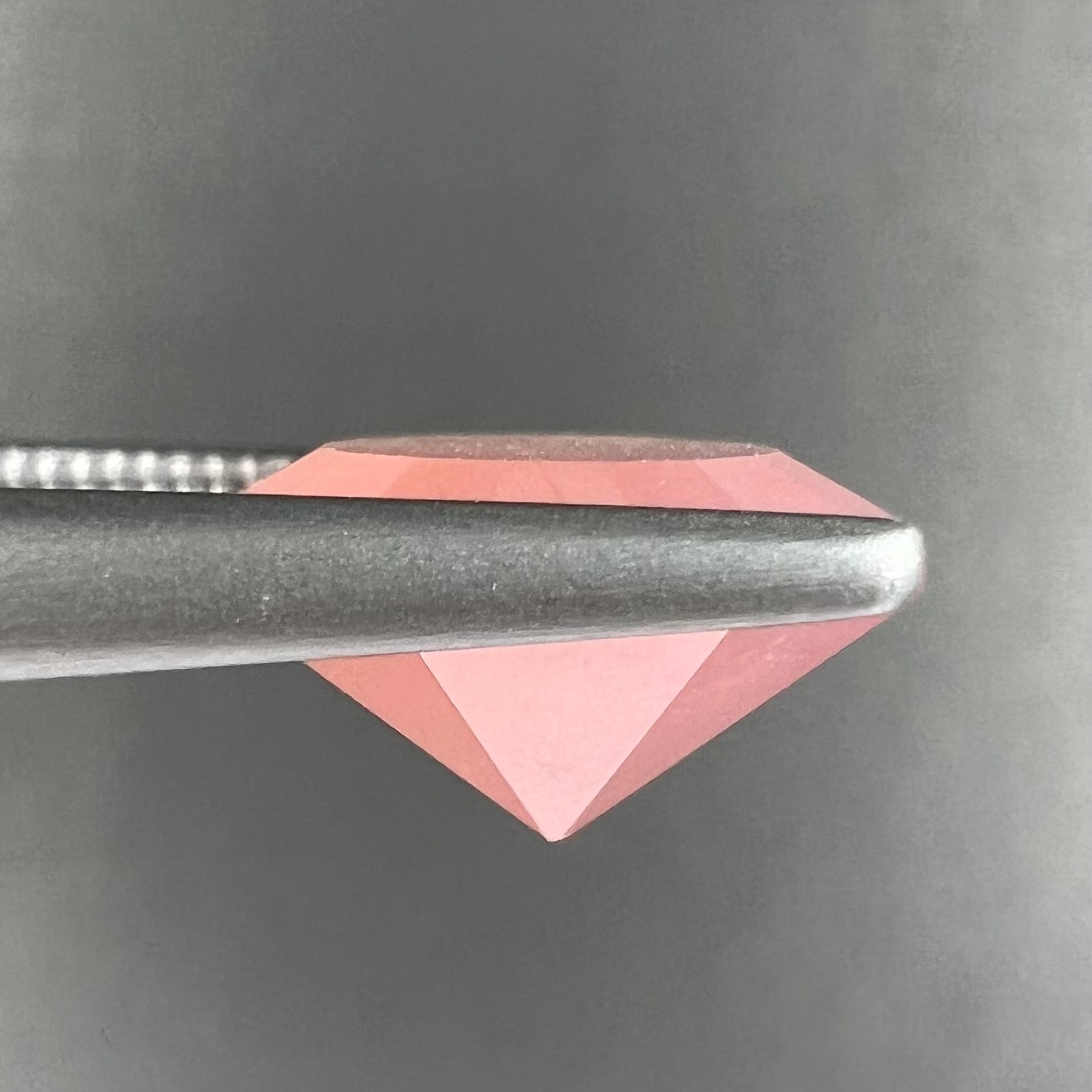 A faceted, octagon cut pink fire opal from Mexico.