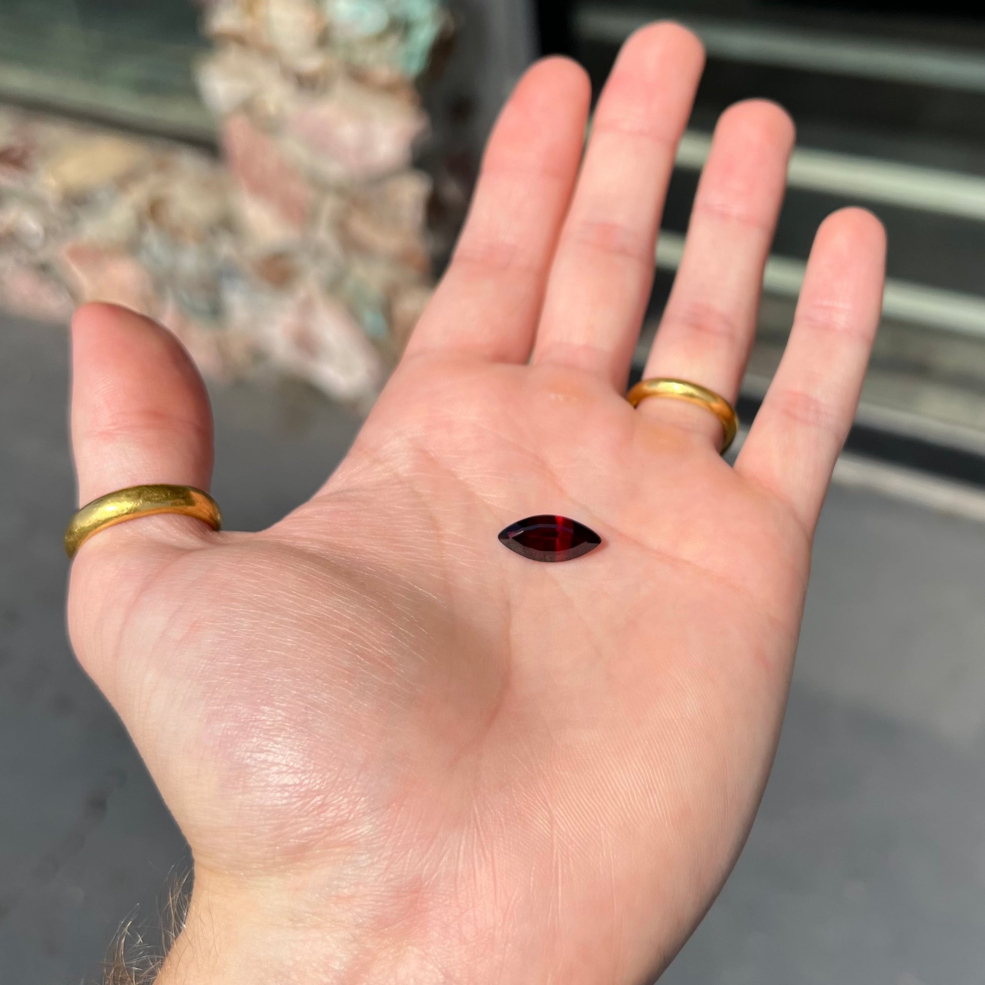 A faceted marquise cut red pyrope garnet stone.