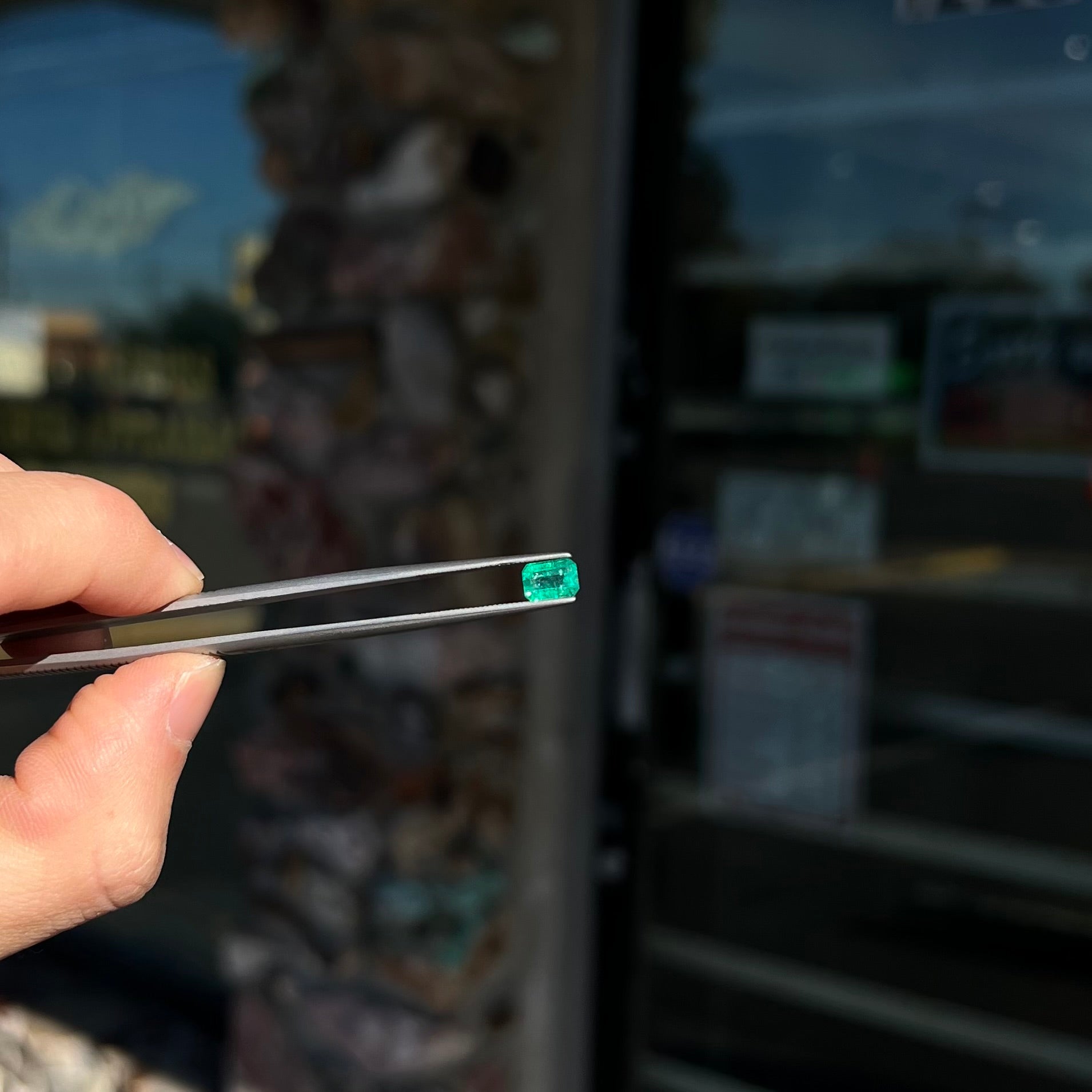 A loose, natural emerald gemstone.  The stone is emerald cut.