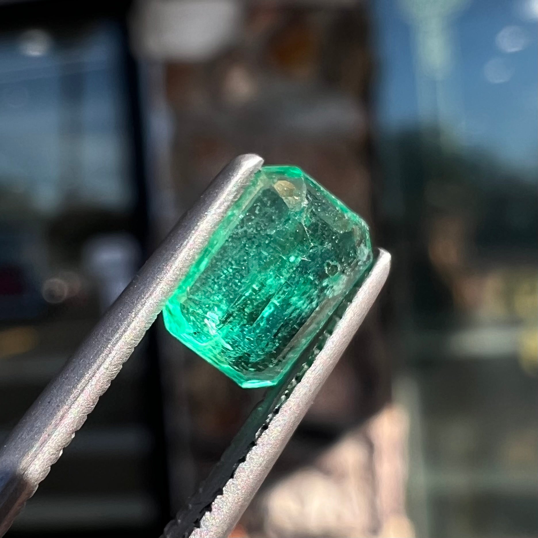 A loose, natural emerald gemstone.  The stone is emerald cut.
