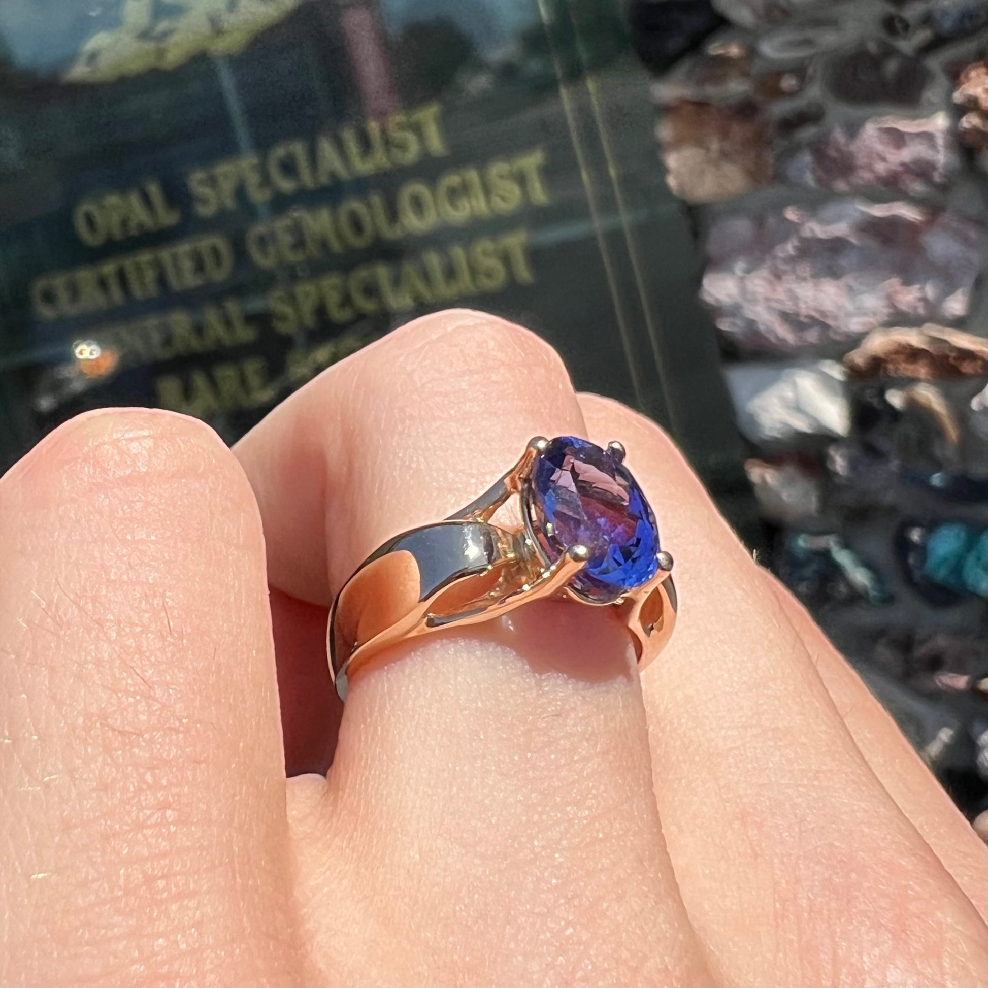 A ladies' oval cut tanzanite solitaire ring set in yellow gold.