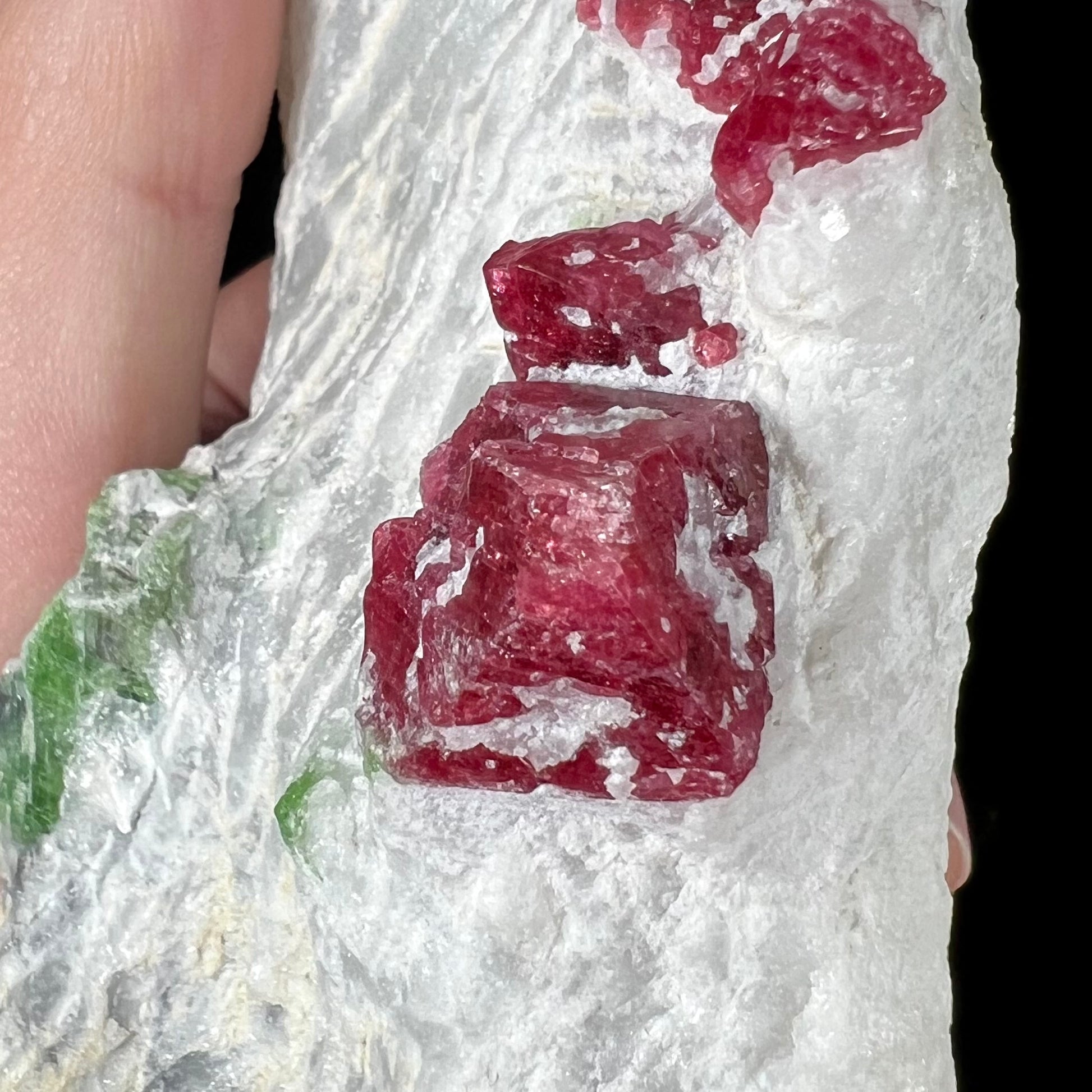 A red spinel crystal exhibiting the cubic crystal system in white calcite matrix from Luc Yen District, Vietnam.