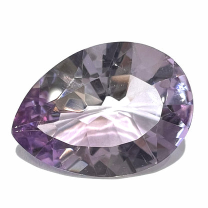 A faceted pear shaped rose de France colored amethyst gemstone.