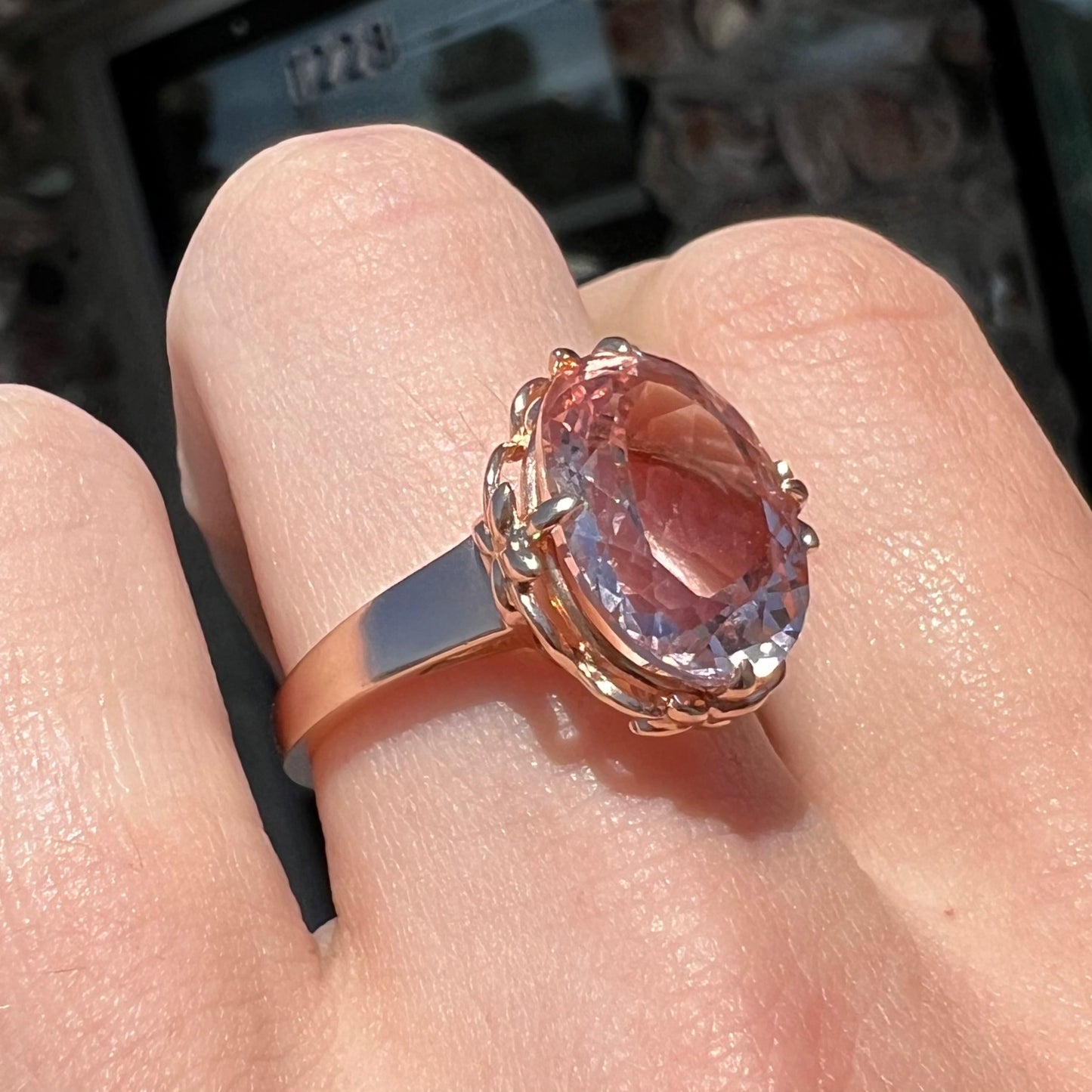 A ladies' rose gold solitaire ring set with an oval cut pink morganite gemstone.