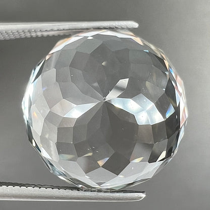 A large, round brilliant cut white topaz gemstone.
