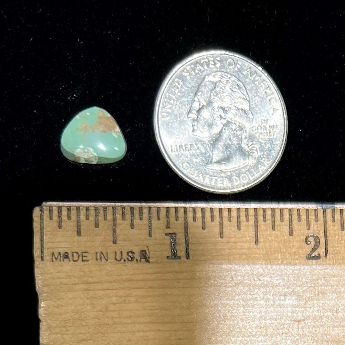 A loose, green Royston turquoise stone.  The stone has a brown matrix.