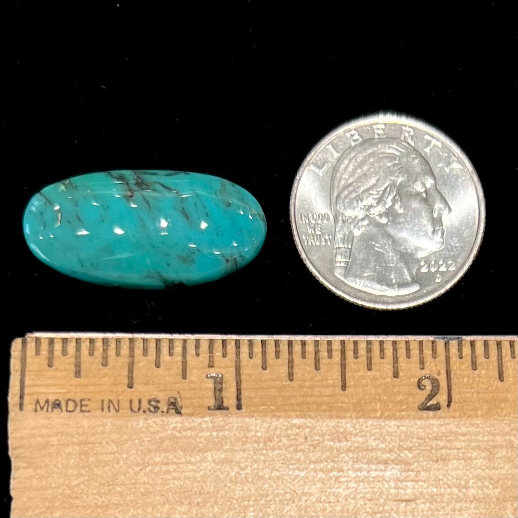 A loose, oval cabochon cut turquoise stone from Royston District, Nevada.