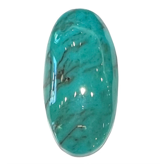 A loose, oval cabochon cut turquoise stone from Royston District, Nevada.