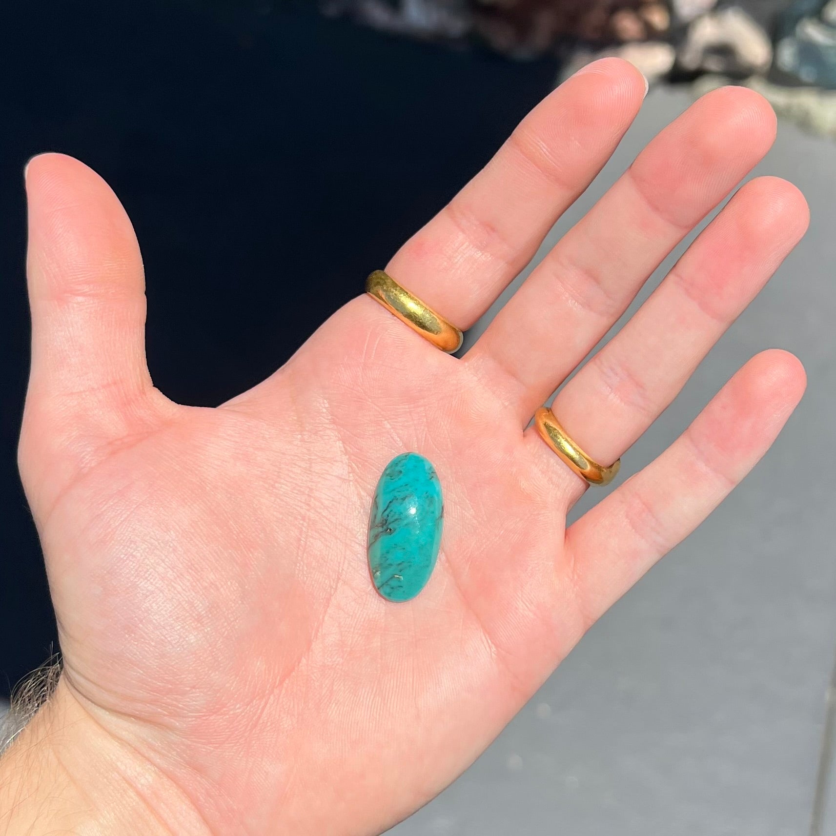 A loose, oval cabochon cut turquoise stone from Royston District, Nevada.