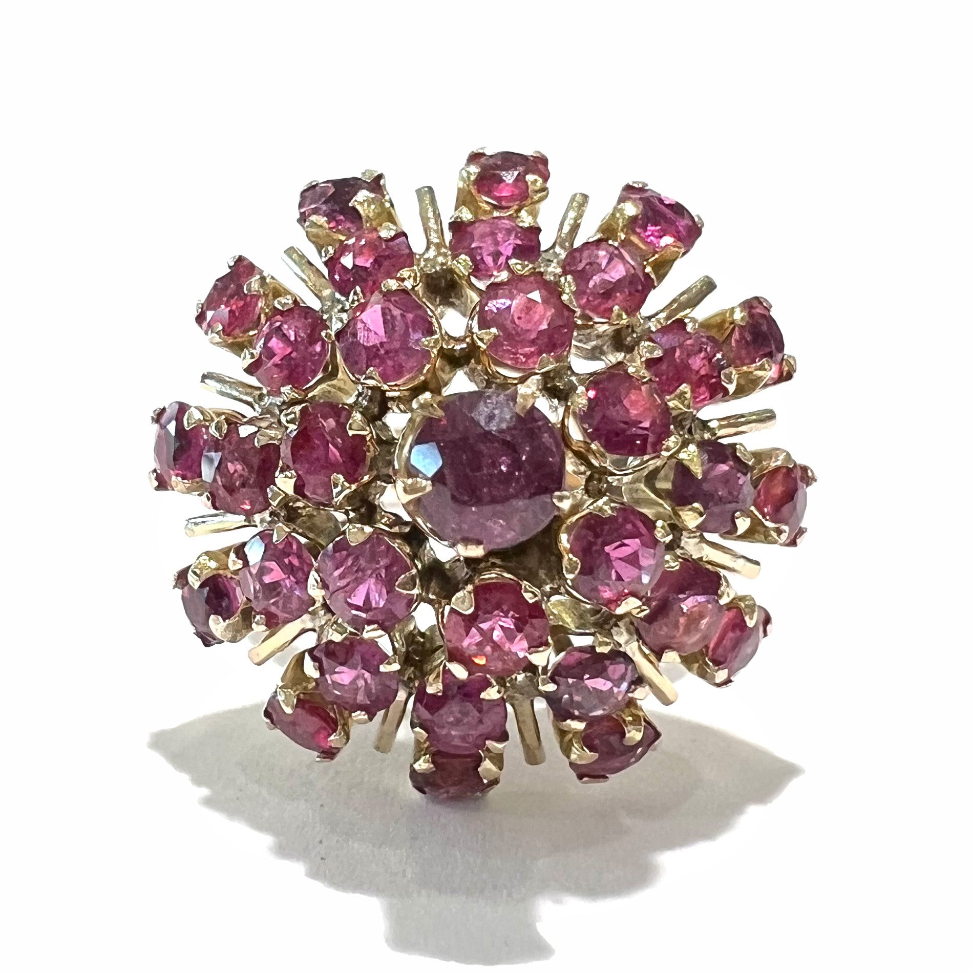 A ladies' vintage Thai princess ring set with round cut purplish red rubies.