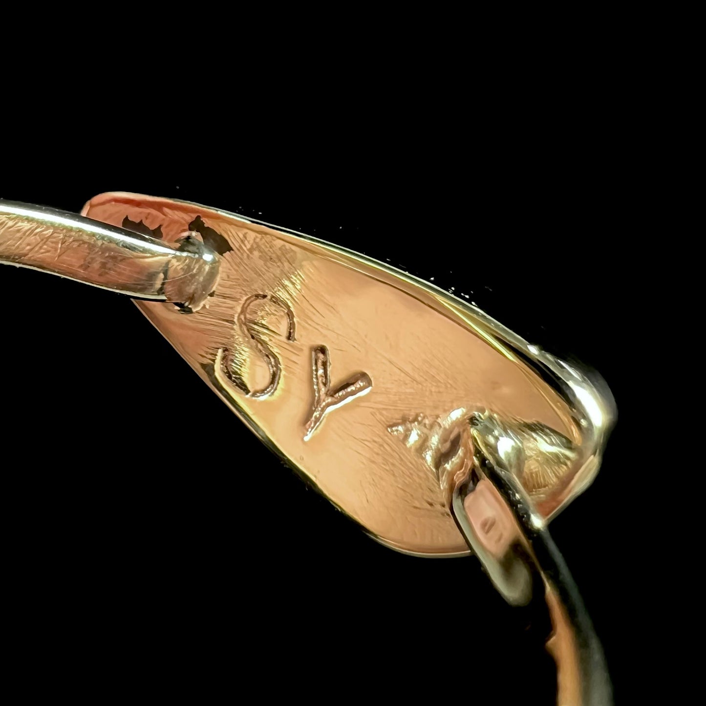 A ladies yellow gold solitaire ring bezel set with a natural opalized seashell from Coober Pedy, Australia.