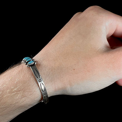 A ladies' sterling silver Zuni Indian turquoise cuff bracelet.  The stones are oval cut Sleeping Beauty turquoise.