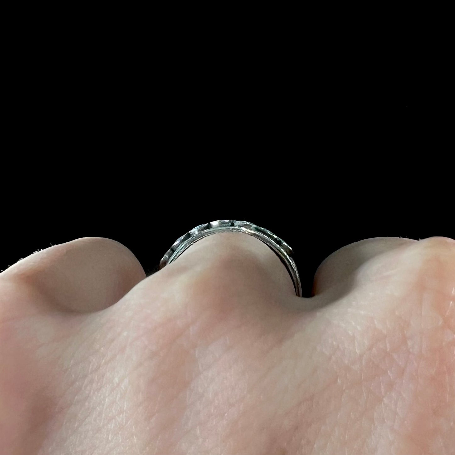 A ladies' sterling silver Hopi style band set with round cut Sleeping Beauty turquoise stones.