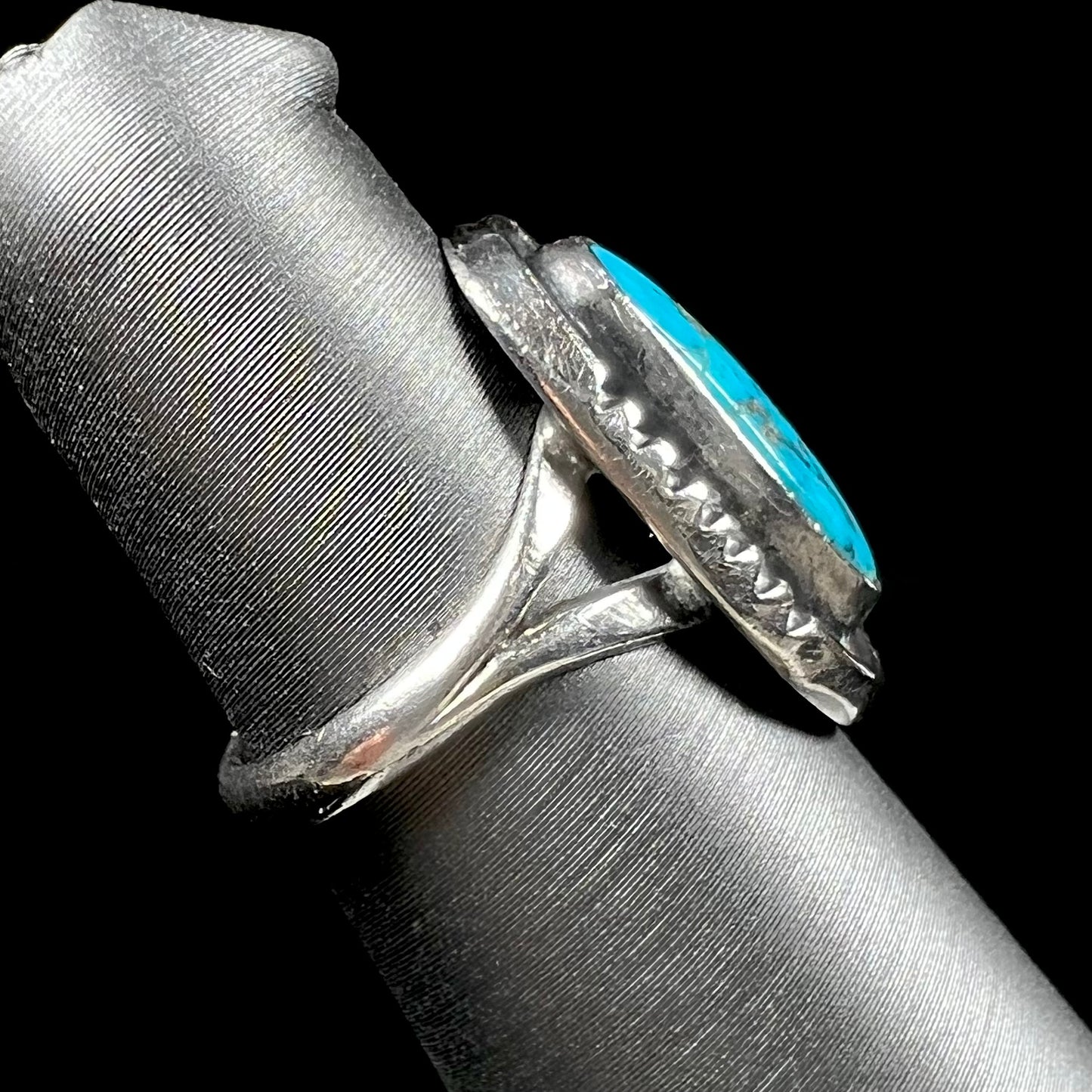 A handmade sterling silver Navajo style ring set with a Morenci turquoise stone.